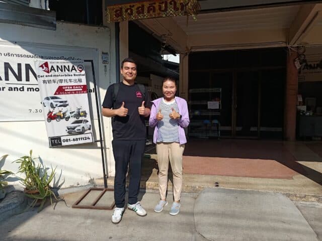 Byklo employee with owner of Anna Motorbike Rental standing outside motorbike shop