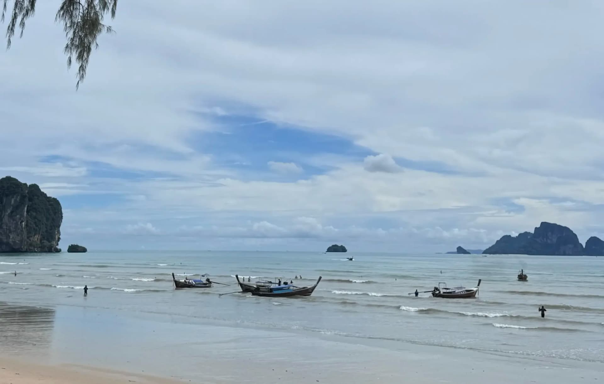Boats by ao nang beach waiting on customers to head out to islands in Krabi