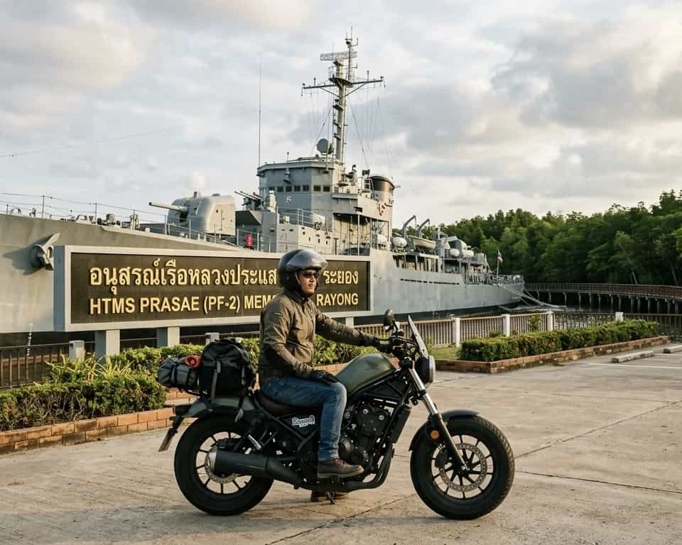 Rider on a Honda Rebel cruiser at the HTMS Prasae warship memorial in Rayong, Thailand: Byklo motorbike rental